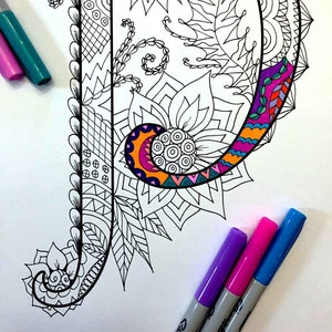 May include: A black and white line drawing of the letter P with intricate floral and geometric designs. The letter is surrounded by three colourful markers, one purple, one pink, and one blue.