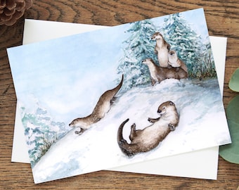 Sledding Otters Christmas card, Holiday greeting card, Eco friendly 5"x7" blank inside, whimsical winter animals, playful Canadian animals