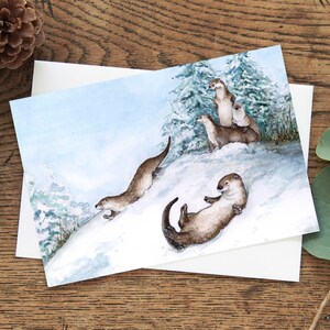 Sledding Otters Christmas card, Holiday greeting card, Eco friendly 5"x7" blank inside, whimsical winter animals, playful Canadian animals