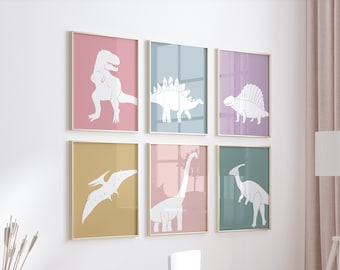 May include: Six framed dinosaur art prints in a child's room. Each print features a white dinosaur silhouette against a pastel background of pink, blue, purple, green, and yellow. The frames are gold.