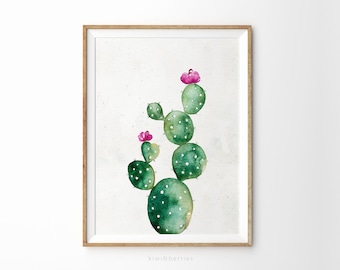 Könnte beinhalten: Aquarellmalerei eines grünen Kaktus mit rosa Blüten. Der Kaktus befindet sich in einem einfachen braunen Rahmen und der Hintergrund ist weiß.