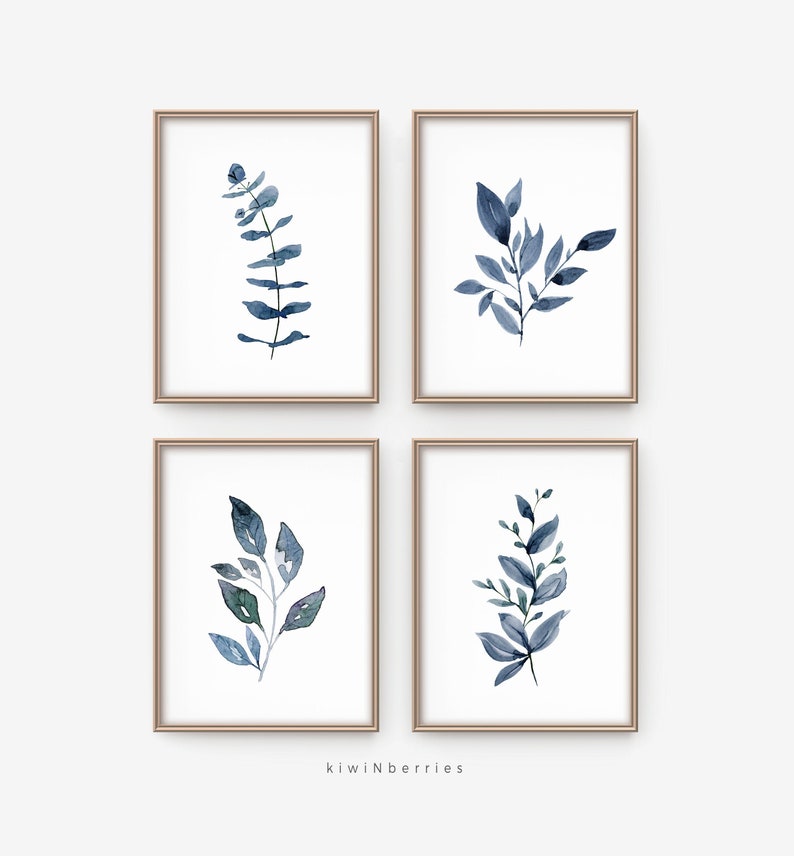 May include: Set of four watercolour prints featuring blue and green foliage in simple frames. The prints are perfect for adding a touch of nature to any room.