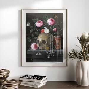 May include: A still life painting featuring a human skull surrounded by pink roses, butterflies, and other flowers. The skull is adorned with a gold band and sits on a dark wooden surface.