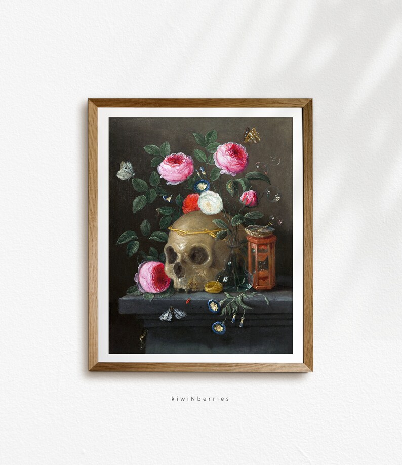 May include: A still life painting of a human skull with a gold crown, surrounded by pink and white roses, a glass bottle, and a small hourglass. The skull is resting on a dark ledge with a few blue flowers and a moth.