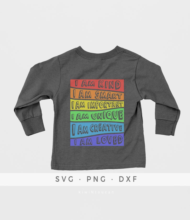 May include: A dark grey long-sleeved shirt with a rainbow-colored design on the back. The design features the text "I am kind", "I am smart", "I am important", "I am unique", "I am creative", and "I am loved".