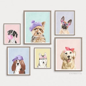 May include: Five framed watercolor illustrations of dogs wearing different accessories. The dogs are a black and white spotted dog wearing a pink bubble, a brown and white dog wearing a purple baseball cap, a brown and white dog wearing a purple beret, a white and grey dog wearing a pink headband with white polka dots, and a golden retriever wearing a pink headband with white polka dots. The illustrations are on a white background.