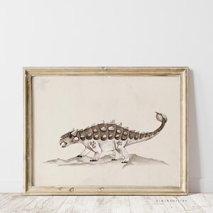 May include: A framed illustration of a brown and white Ankylosaurus dinosaur with a spiky tail, walking on a beige background.