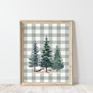May include: A framed print of three watercolour pine trees on a grey and white gingham background.