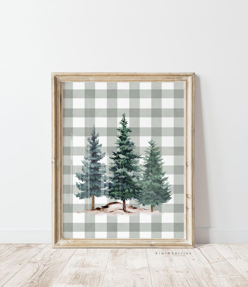 May include: A framed print of three watercolour pine trees on a grey and white gingham background.