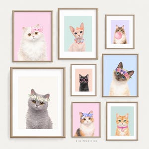 May include: A collection of framed cat portraits. Each portrait features a different cat breed, adorned with accessories like flower crowns, bows, and necklaces. The cats are set against pastel backgrounds, creating a whimsical and artistic display.