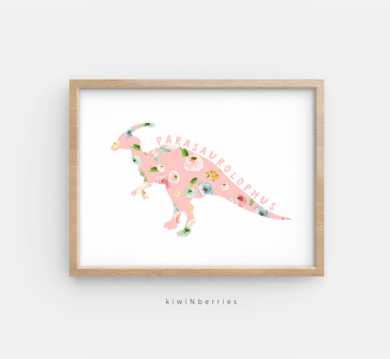 May include: A pink floral print Parasaurolophus dinosaur silhouette on a white background. The dinosaur's name is written in pink letters along the curve of its neck.