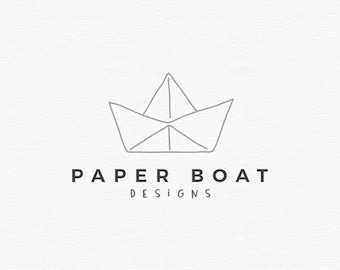 May include: A simple line drawing of a paper boat with the text "PAPER BOAT DESIGNS" below it.