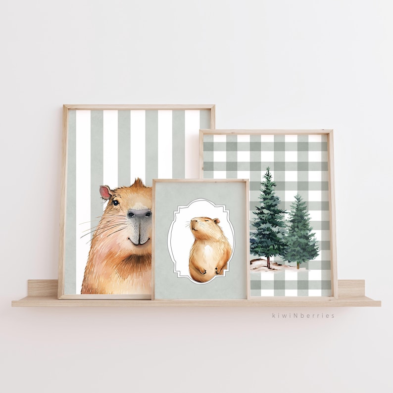 May include: Three framed prints featuring a green and white gingham pattern, a green and white striped pattern, and a watercolour illustration of a capybara. The capybara is shown in two different poses, one with a close-up of its face and the other with the capybara sitting upright.