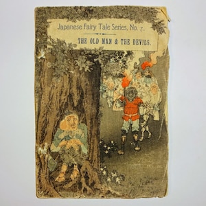 May include: An old man sits under a tree, while a group of devils with red and white clothing and a red torch approach him. The cover of this book is titled "Japanese Fairy Tale Series, No. 7. The Old Man & The Devils."