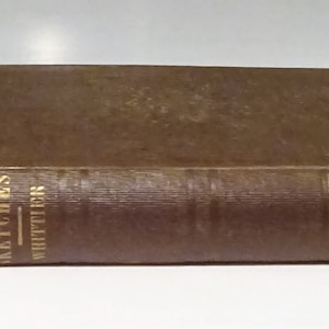 May include: A brown hardcover book with gold lettering on the spine that reads "Old Portraits and Modern Sketches Whittier". The book is published by "H.M. Caldwell Co."