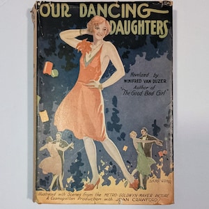 May include: Vintage book cover for "Four Dancing Daughters." The cover features an illustration of a woman in an orange dress, with dancers in the background. The title and author's name are displayed at the top. The book is a Metro-Goldwyn-Mayer picture.