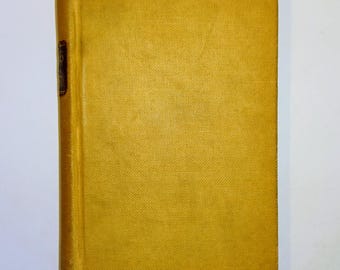 May include: A yellow hardback book with a brown spine.
