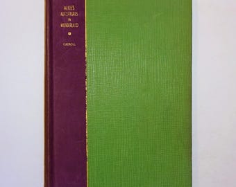 May include: A green and burgundy hardcover book with the title "Alice's Adventures in Wonderland" and the author "Carroll" printed in gold on the spine.