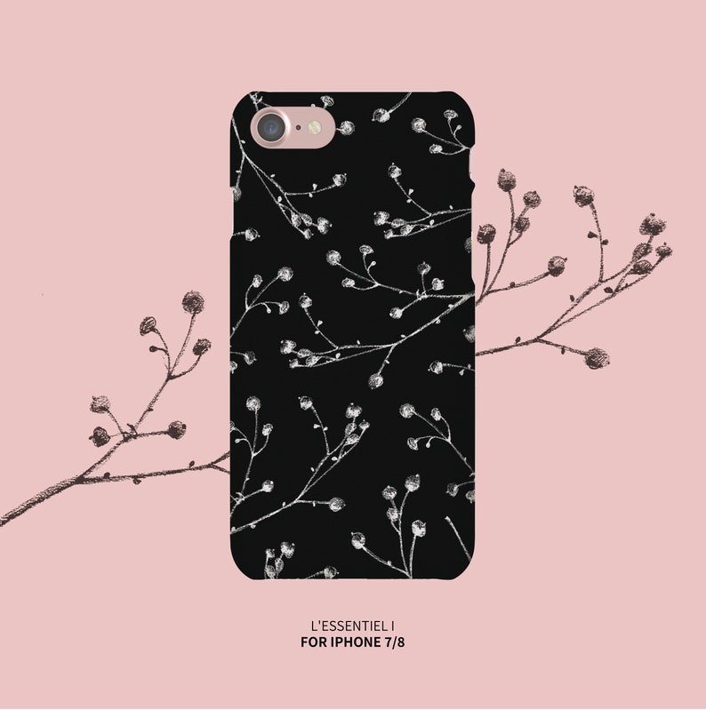 May include: Black phone case with a white floral pattern. The case is designed for iPhone 7/8 and has the text "L'ESSENTIEL I" printed on the bottom.