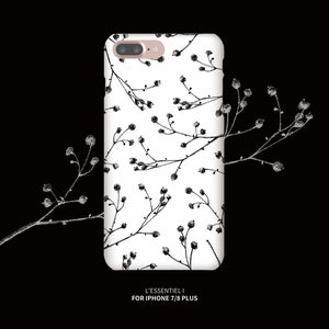 May include: A white iPhone case with a black and white floral pattern. The case is designed for iPhone 7/8 Plus and features the text "L'ESSENTIEL I".
