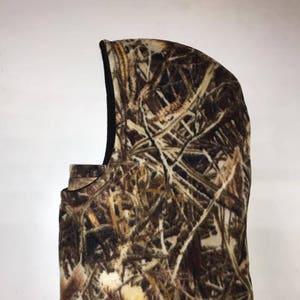 May include: A brown, tan, and white camouflage fleece balaclava with a black fleece lining.