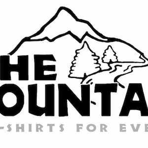 May include: Black and white logo for The Mountain, a company that sells t-shirts. The logo features a stylized mountain with a winding path and two trees. The text "The Mountain" is in bold, black letters and the tagline "Great T-shirts for Everybody" is in gray letters.
