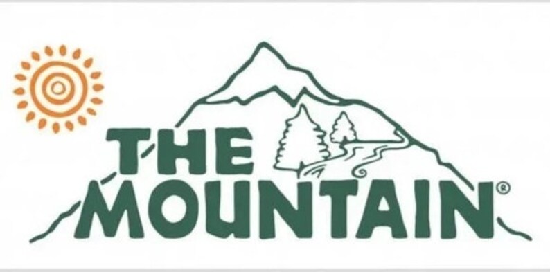 May include: A green logo with the text "THE MOUNTAIN" in a bold, stylized font. A stylized mountain with a winding path and two trees is behind the text. A stylized sun with orange and brown accents is in the upper left corner.