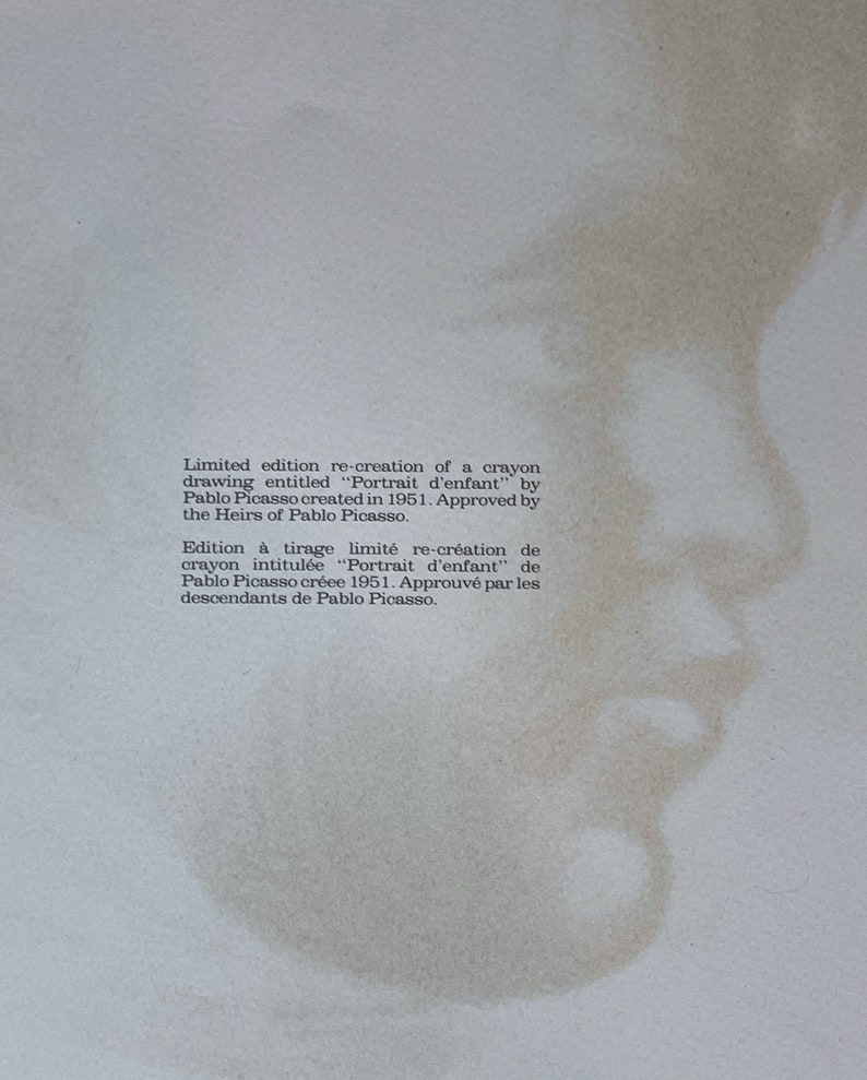 May include: A limited edition re-creation of a crayon drawing titled "Portrait d'enfant" by Pablo Picasso, created in 1951. The image features a faded, sepia-toned portrait of a child's profile, with text describing the artwork.