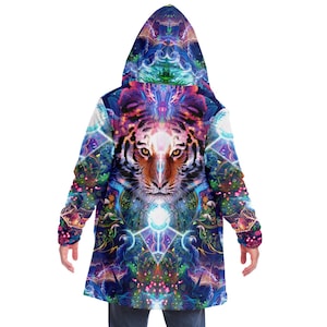 May include: A hooded cloak with a colorful psychedelic design featuring a tiger's face in the center. The design includes swirling patterns, geometric shapes, and vibrant colors like blue, purple, pink, and green.