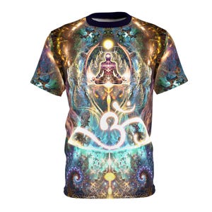 May include: A colorful t-shirt with a psychedelic design featuring a meditating figure and the Om symbol. The shirt has a navy blue crew neck and short sleeves.