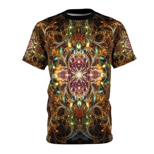 May include: A black t-shirt with a colorful, intricate mandala design featuring gold, red, green, and blue hues. The mandala is surrounded by a swirling pattern of lines and dots.