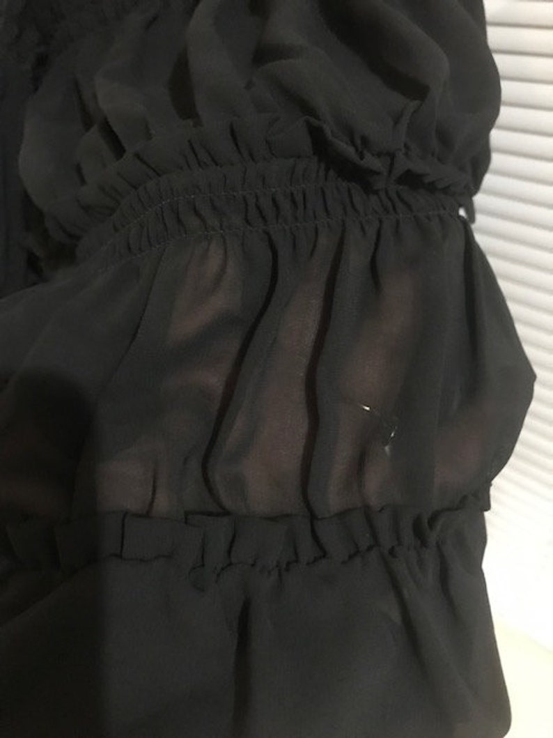 sheer black off the shoulder blouse