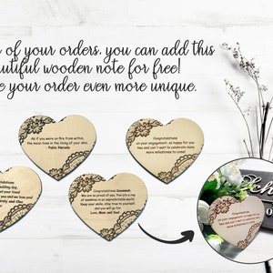 Personalized wooden gift note add-on. Laser engraved heart tags used as durable gift cards. Explanatory image showing how to add a custom message on wood to your order for a unique gift presentation.