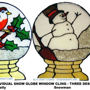 May include: Three individual snow globe window clings featuring a robin and holly, a snowman, and Santa Claus. Each cling is a circular design with a white background and glitter accents.