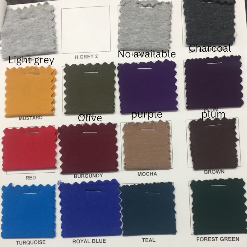 May include: Swatch card showing fabric samples in various colors, including light grey, mustard, red, turquoise, olive, purple, plum, burgundy, mocha, brown, royal blue, teal, and forest green.