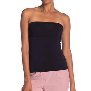 May include: A black strapless top made from stretchy fabric. The top is fitted and has a smooth, seamless finish.