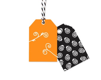 May include: Two Halloween gift tags with string. One tag is orange with a white swirl design. The other tag is black with a white swirl pattern.