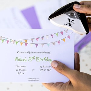 May include: A white invitation card with a colorful bunting design at the top. The text on the card reads "Come and join us to celebrate Alice's 8th Birthday. Saturday 23 March 3-5 PM AT 23 Parkside SW15 3RN RSVP. MARIA STEV maria@mail.com".