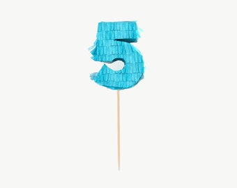 May include: A blue paper mache number five pinata on a wooden stick.