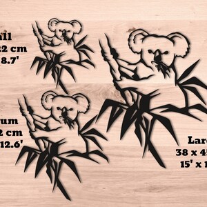 May include: Three black silhouette designs of a koala bear sitting in a bamboo tree. The designs are available in three sizes: small (7.3 inches by 8.7 inches), medium (10.5 inches by 12.6 inches), and large (15 inches by 17.7 inches).
