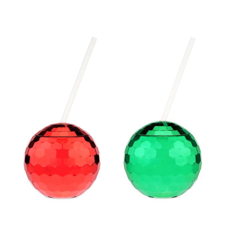 May include: Two disco ball-shaped cups with straws. One cup is red and the other is green.