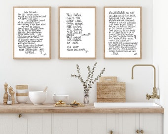 May include: Three framed prints with black text on a white background. The prints are hanging on a white wall above a wooden countertop. The text on the prints is about taking time to slow down and appreciate the simple things in life.