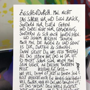 May include: A set of three ceramic mugs with a speckled, matte finish. The mugs are in shades of cream, light grey, and dark grey. Each mug has a simple, minimalist design and a rounded handle.