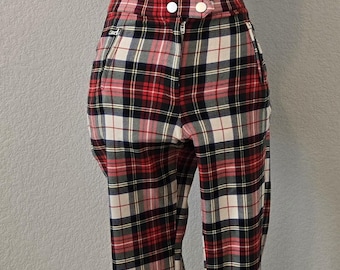 May include: Red, black, and white plaid pants with a zipper and button closure.