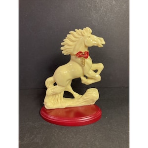 Horse statue Figurine on red wood base rearing flowing mane heavy yellow Plastic