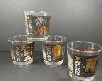 Juego de 4 vasos coleccionables antiguos de TWA con destino a aerolíneas, color negro y dorado, de Lowball Atomic