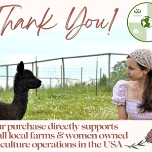 May include: A black alpaca stands in a grassy field next to a woman wearing a pink and white gingham dress and a headband. The text "Thank You!" is at the top of the image. The text "Your purchase directly supports small local farms & women owned agriculture operations in the USA" is at the bottom of the image.