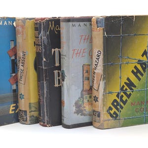 May include: A selection of old books with distressed covers. Titles visible include "Basle Express," "Among Those Absent," and "Green Hazard." The books feature a range of colours, such as blue, yellow, and black, with signs of age and use.
