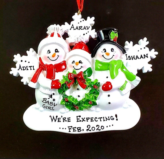 family ornaments with pregnant mom