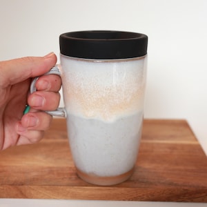 Ceramic travel mug with handle and silicone lid. Handmade travel mug, Handmade ceramic mug, lidded coffee cup, Roam Ceramics.